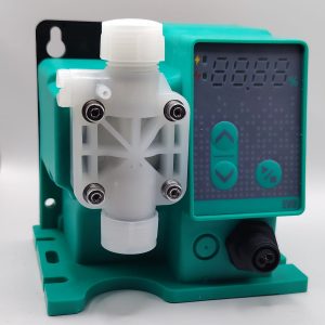DOSING PUMP SMAY - DOSECO Chemical Dosing Pumps Close-up of a turquoise irrigation timer with a white valve assembly and a digital display showing settings